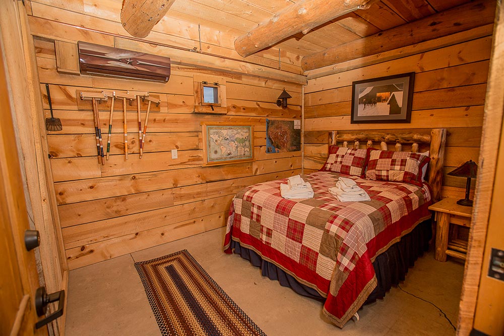 Bed in a room with cabin decor