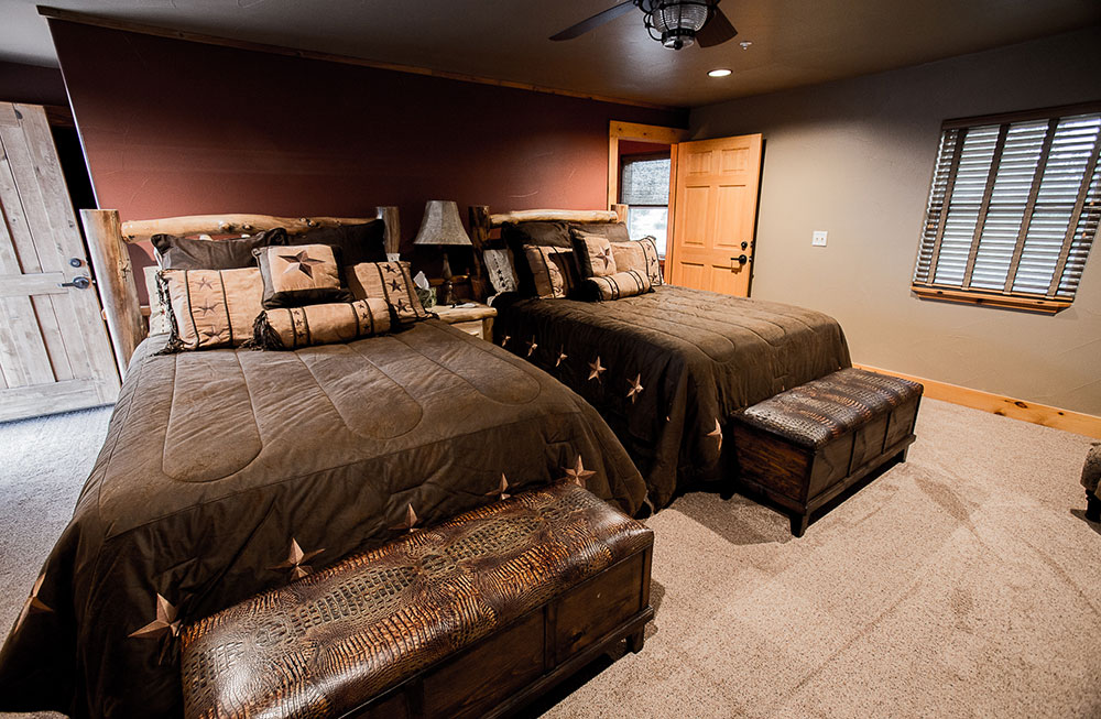 Two large beds with brown comforters