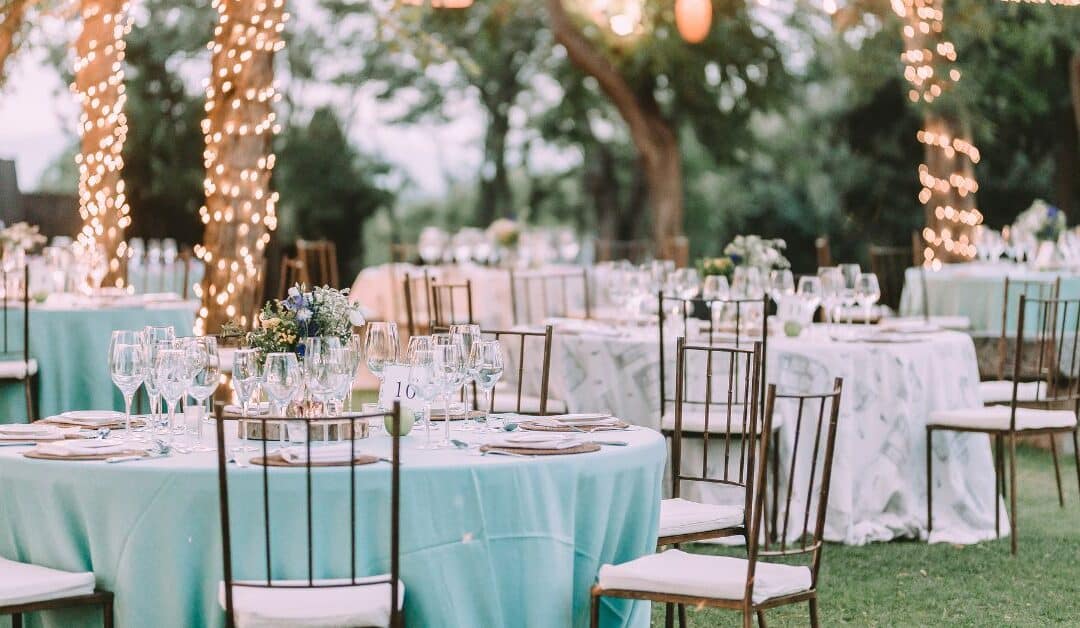 Tables and chairs set for an outdoor wedding